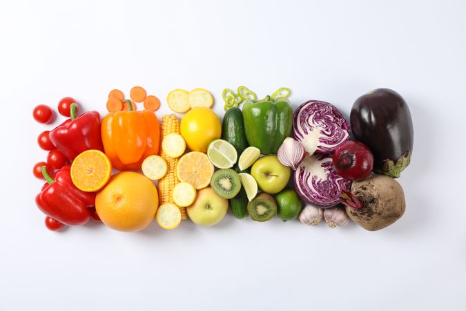 Flat lay with different vegetables and fruits on plain background, copy space