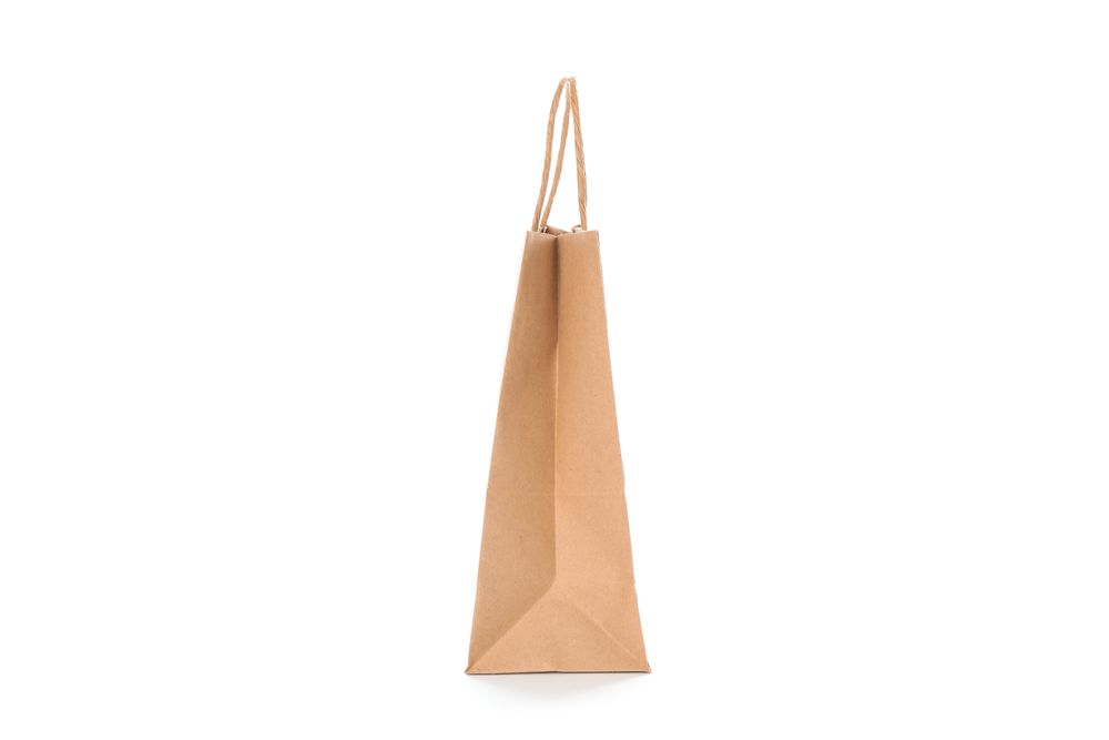 Empty paper bag isolated on blank background