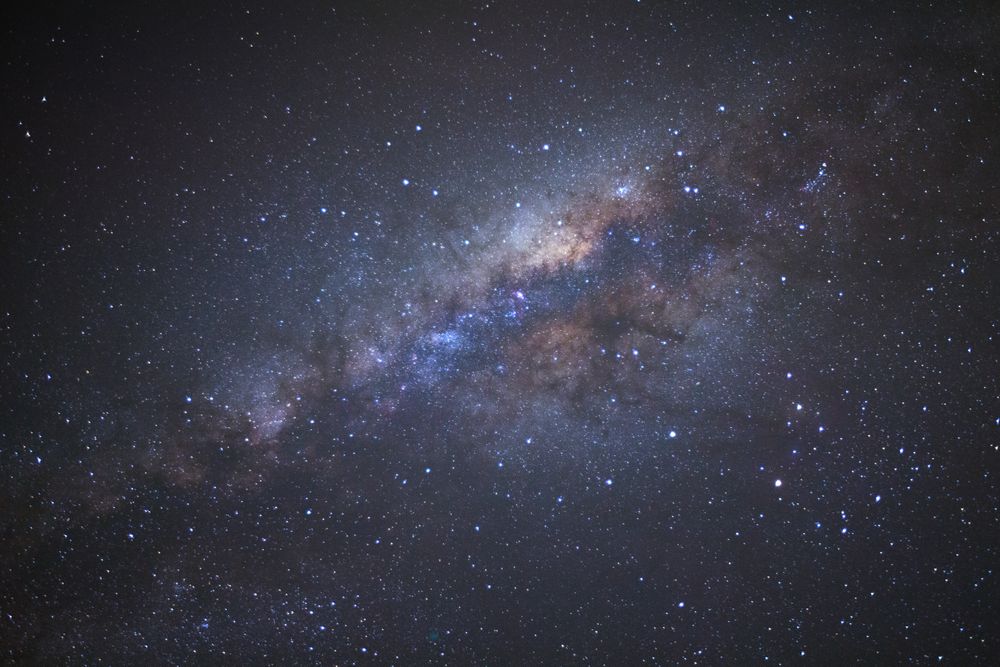 Milky way galaxy with stars and space dust in the universe, Long exposure photograph, with grain.