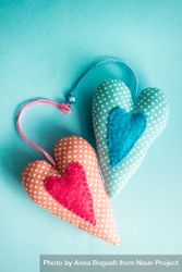 Felt heart ornaments on pastel blue background 5zrr7j