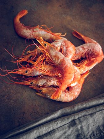 Tasty raw shrimps on table