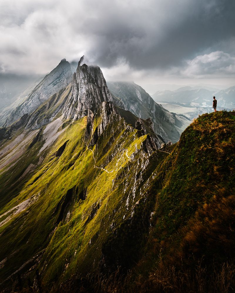 Man standing on top of mountain