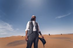 Bearded cowboy in desert