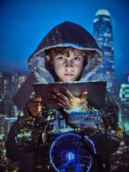 Boy with tablet in city projection