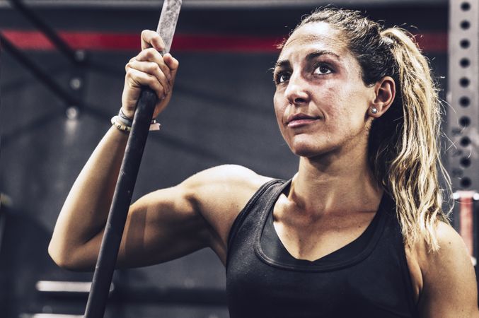 Serene woman relaxing in gym