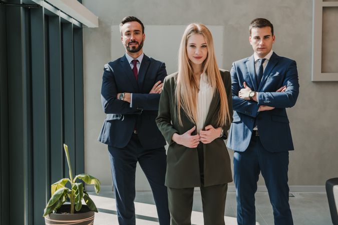 Business colleagues standing with crossed arms