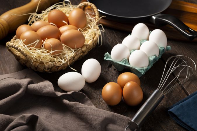 Chicken eggs go up on the table.