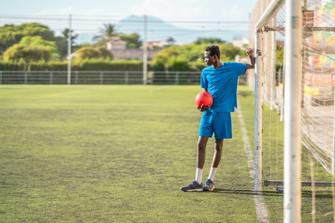 Black teenager on football field