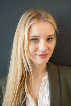Gorgeous female portrait posing in business suit