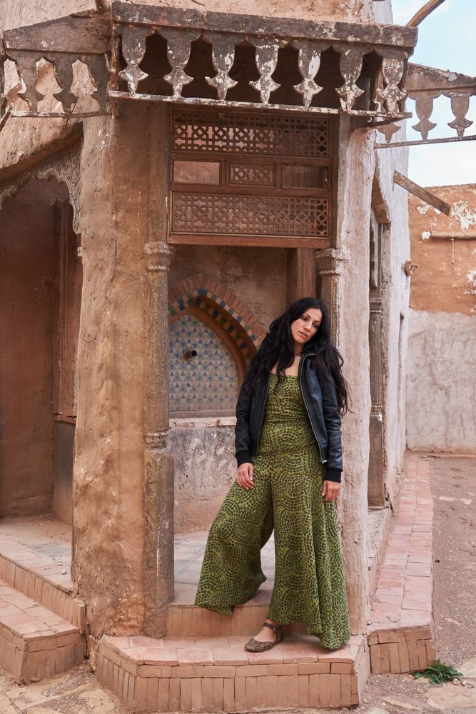 Woman on street between ancient buildings