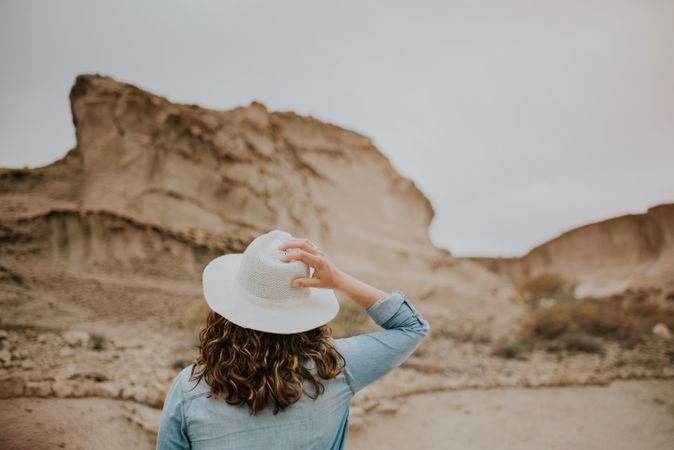 Female tourist walking on sandy quarry