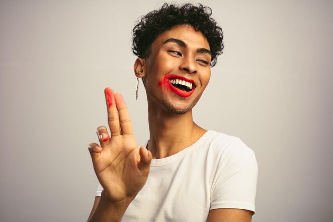 Smiling man with smudged lipstick