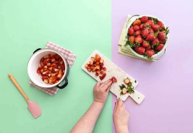 Prepping and slicing strawberries for a pie filling