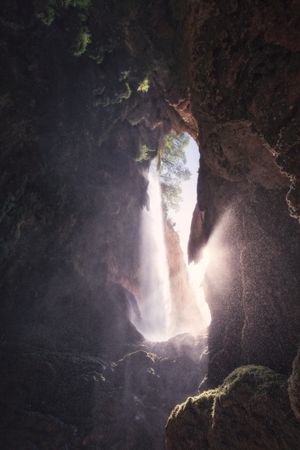 Bright sunlight through rocky cave
