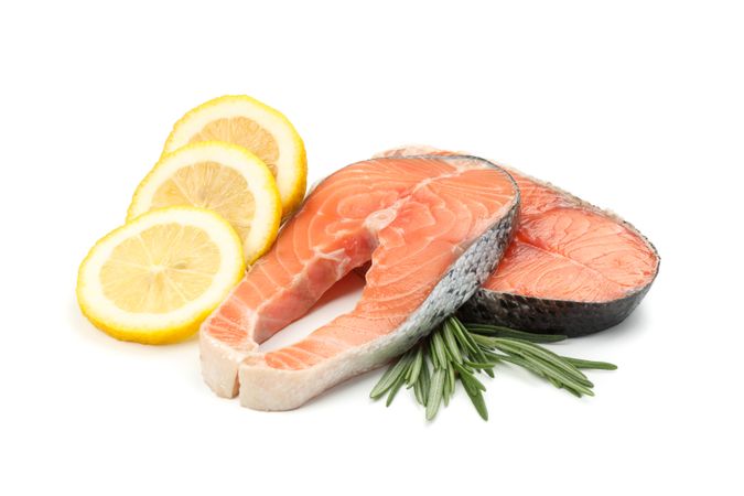 Fresh raw salmon meat and spices isolated on light background