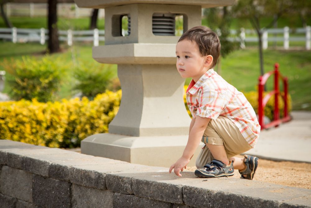 Young Chinese and White Boy Having Fun at the Park.