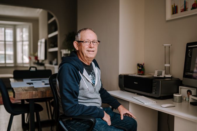 Portrait of man in his home office