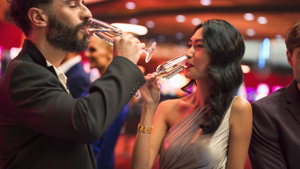 Portrait of a Asian Female Winning a Bet at a Casino Table.