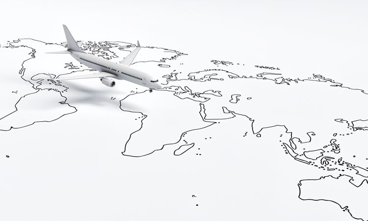 Wide shot of plane model going over drawn map travel plane
