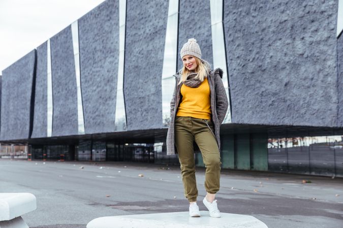 Blonde woman posing in the city