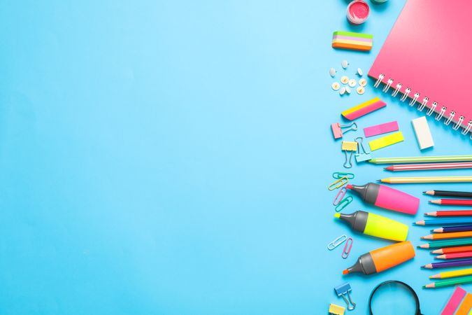 Flat lay composition with school supplies on color background, space for text