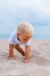Blond baby on the beach