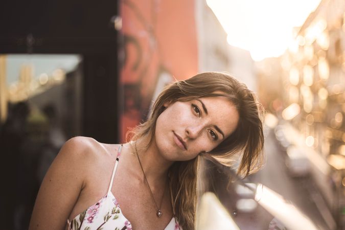 dreamy woman against sunny blurred background