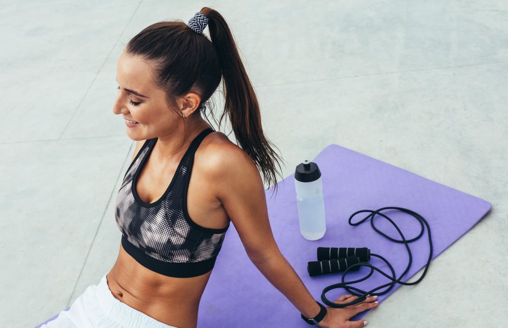 Fitness female resting after workout – Jacob Lund Photography