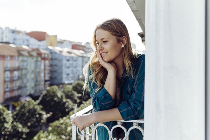 Young woman looking away on balcony