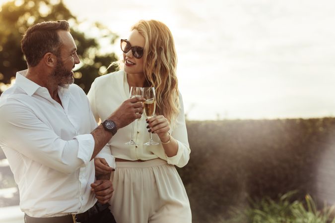 Romantic couple toasting wine