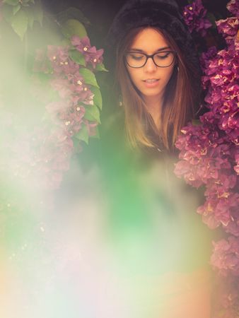 Woman on background of stunning violet flowers