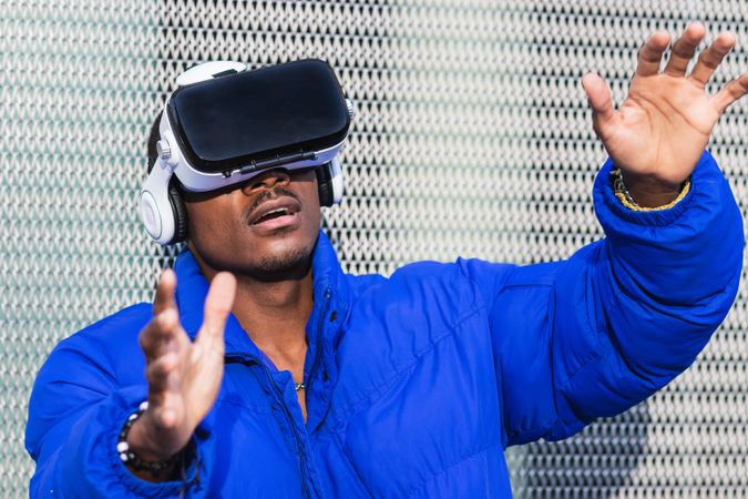 Black man experiencing virtual reality in city