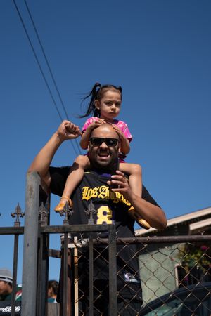 Los Angeles, CA, USA — June 7th, 2020: little girl sitting on her dad’s shoulders at protest rally