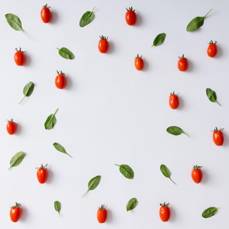 Tomato and basil pattern on light background