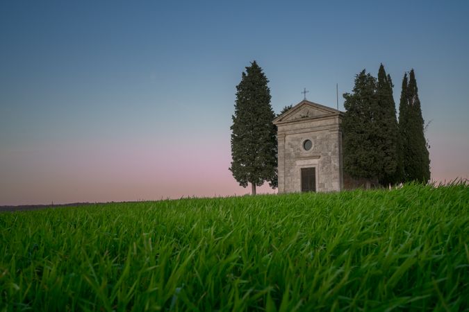 Single chapel among trees on field