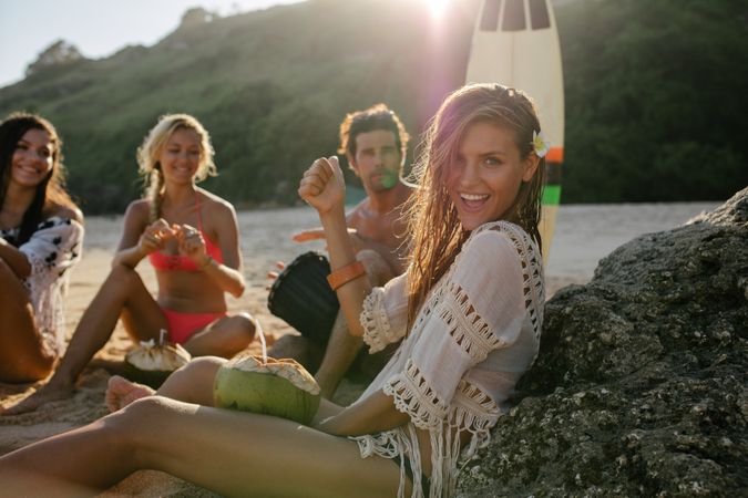 Group of friends enjoying summer holidays on the beach