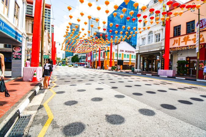 Street decorated with Chinese New Year red Lanterns at daytime in Singapore