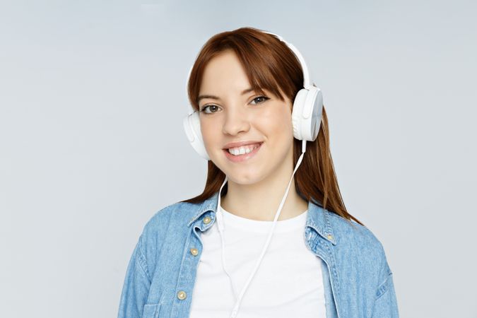 Concept of people, woman with headphones on light background
