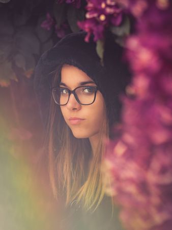 Woman on background of stunning violet flowers