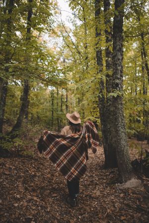 Young female resting in autumn forest