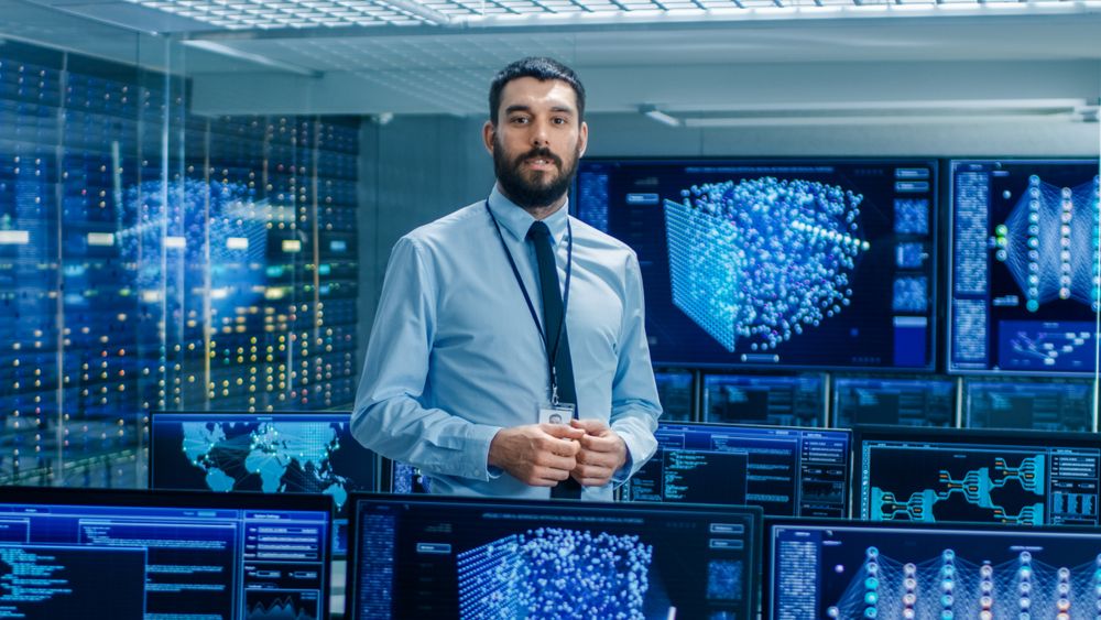 In the Artificial Intelligence Engineering Laboratory Scientist Excitedly Describes Project He's Working on.