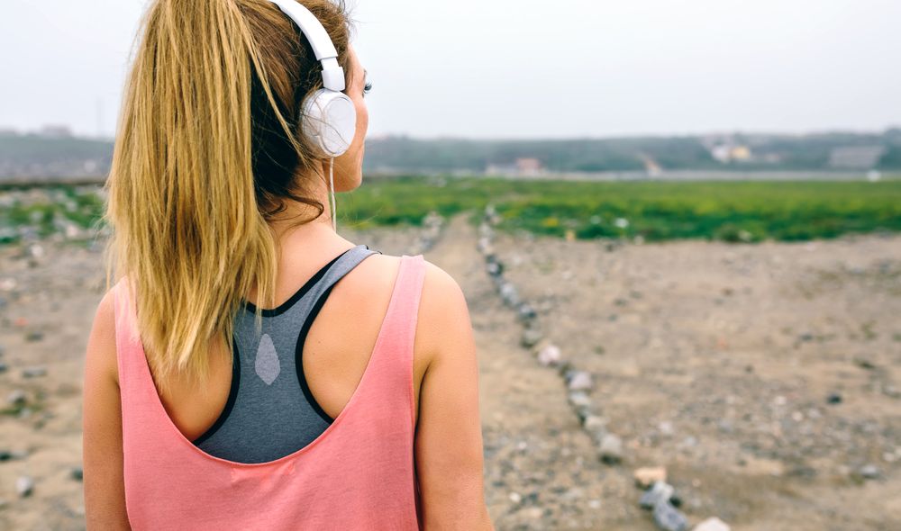 Young sportswoman watching the way