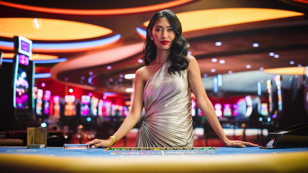 Portrait of a Professional Female Croupier Looking at the Camera and Welcoming You to a Table.