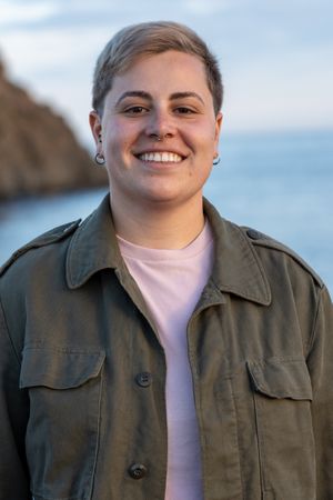 Happy Non-Binary Woman with Short Hair