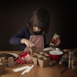 Girl preparing for planting seeds