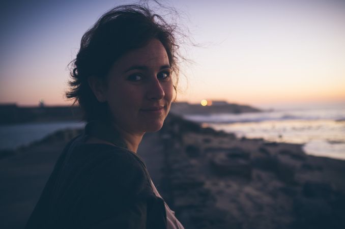 Beautiful female near waving sea