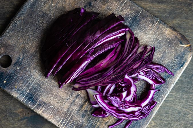 Freshly cut red cabbage on wooden board