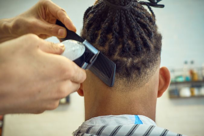 Anonymous hairstylist doing a haircut