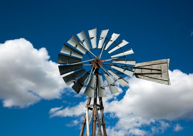 Windmill against a blue sky with clouds Murdo, South Dakota