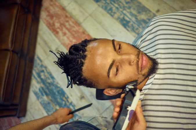 Anonymous hairstylist doing a haircut